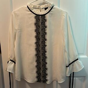 Ivory blouse, with black lace accent, size M
